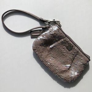 Adorable sequined Coach wristlet.